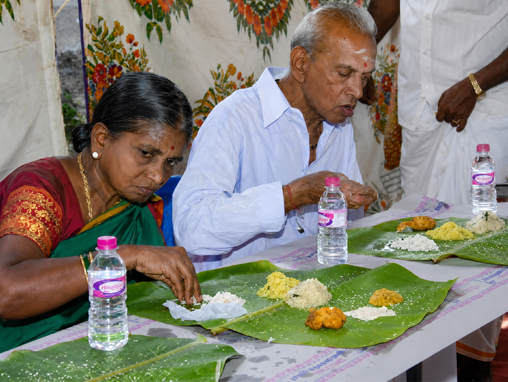Indian wedding guests eating banana leaf meal — observing real buyer behavior